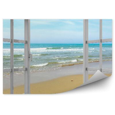 Samolepící fototapeta Pláž a mírné vlny z otevřeného okna