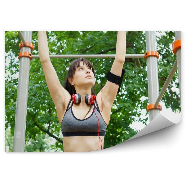 Fototapeta na zeď Žena zvedající na hrazdě