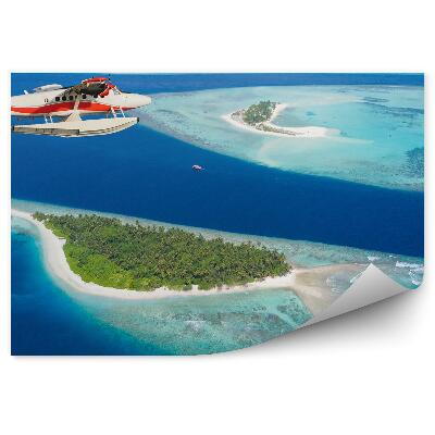 Fototapeta na zeď Letadlo letící nad Maledivskými ostrovy