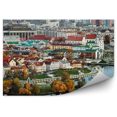 Samolepící fototapeta Panorama města Minsk budovy stromy mosty auta západ slunce