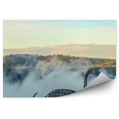 Samolepící fototapeta Figurka brontosaura na pozadí kopců