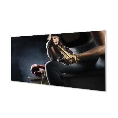 Moderní skleněný obraz Žena si obvazuje ruce